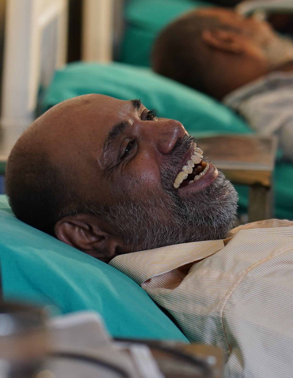 A patient smiling during dialysis