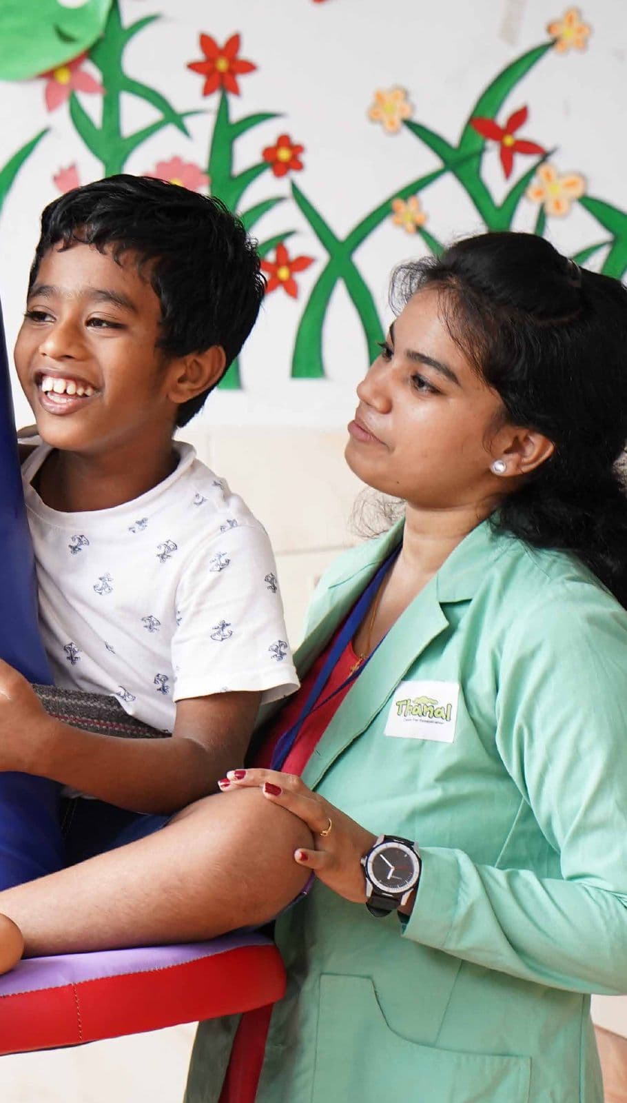 A therapist with a smiling boy